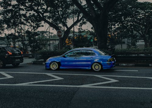 Modern blue car on asphalt road