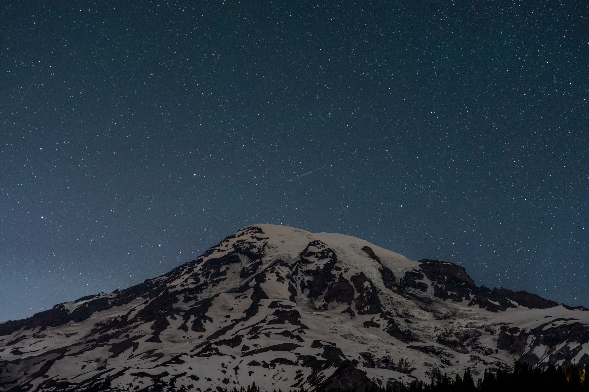 A Snow Covered Mountain and a Starry Night Sky · Free Stock Photo