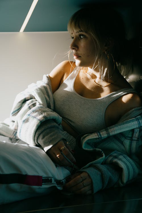 Young stylish woman under bright sunlight