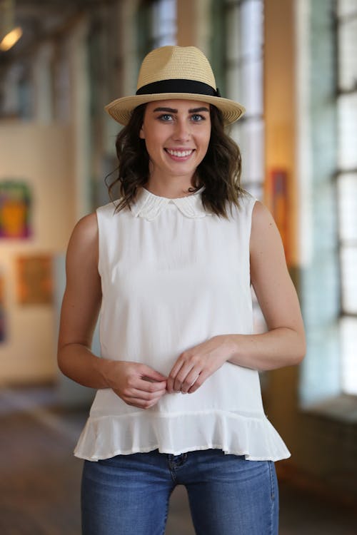 Free Woman in White Sleeveless Top Wearing Straw Fedora Hat Stock Photo