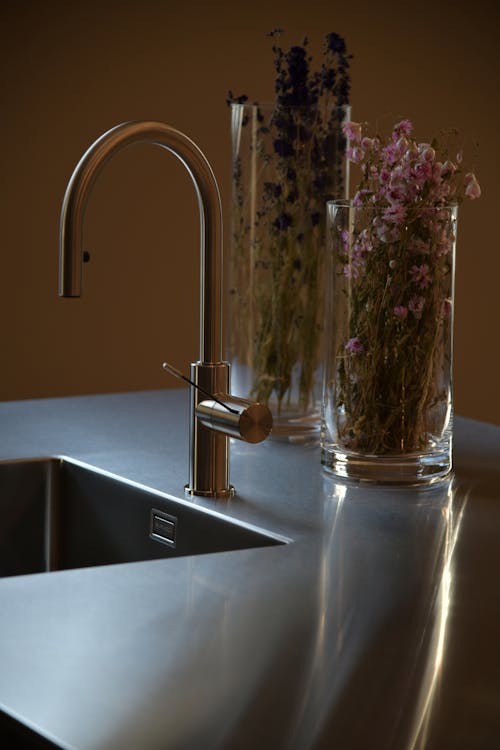 Free Stainless Steel Faucet on the Sink Stock Photo