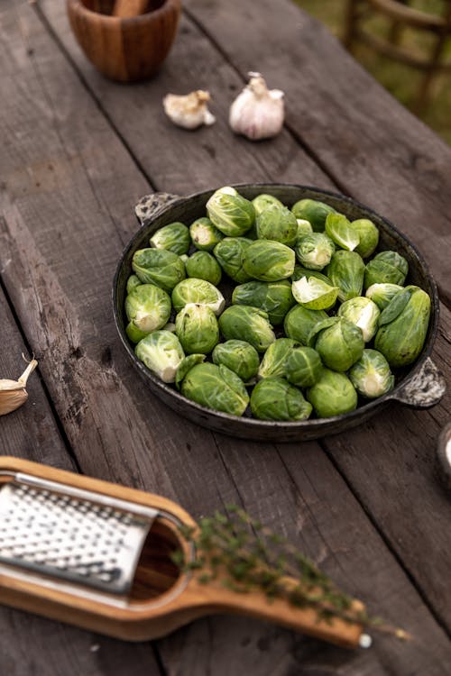 Photo Of Brussels Sprouts On Wooden Surface 
