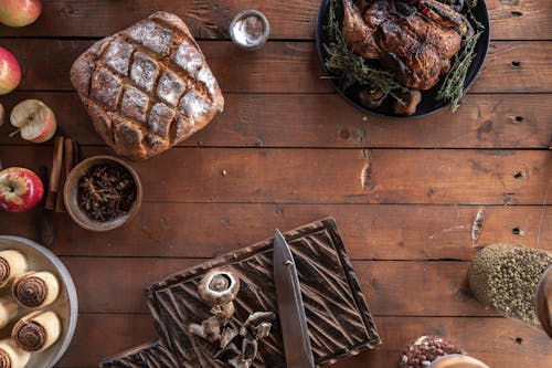 Roasted Turkey, Bread and Cinnamon Rolls on the Table