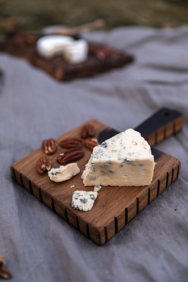 Blue Cheese and Pecans on a Cutting Board 