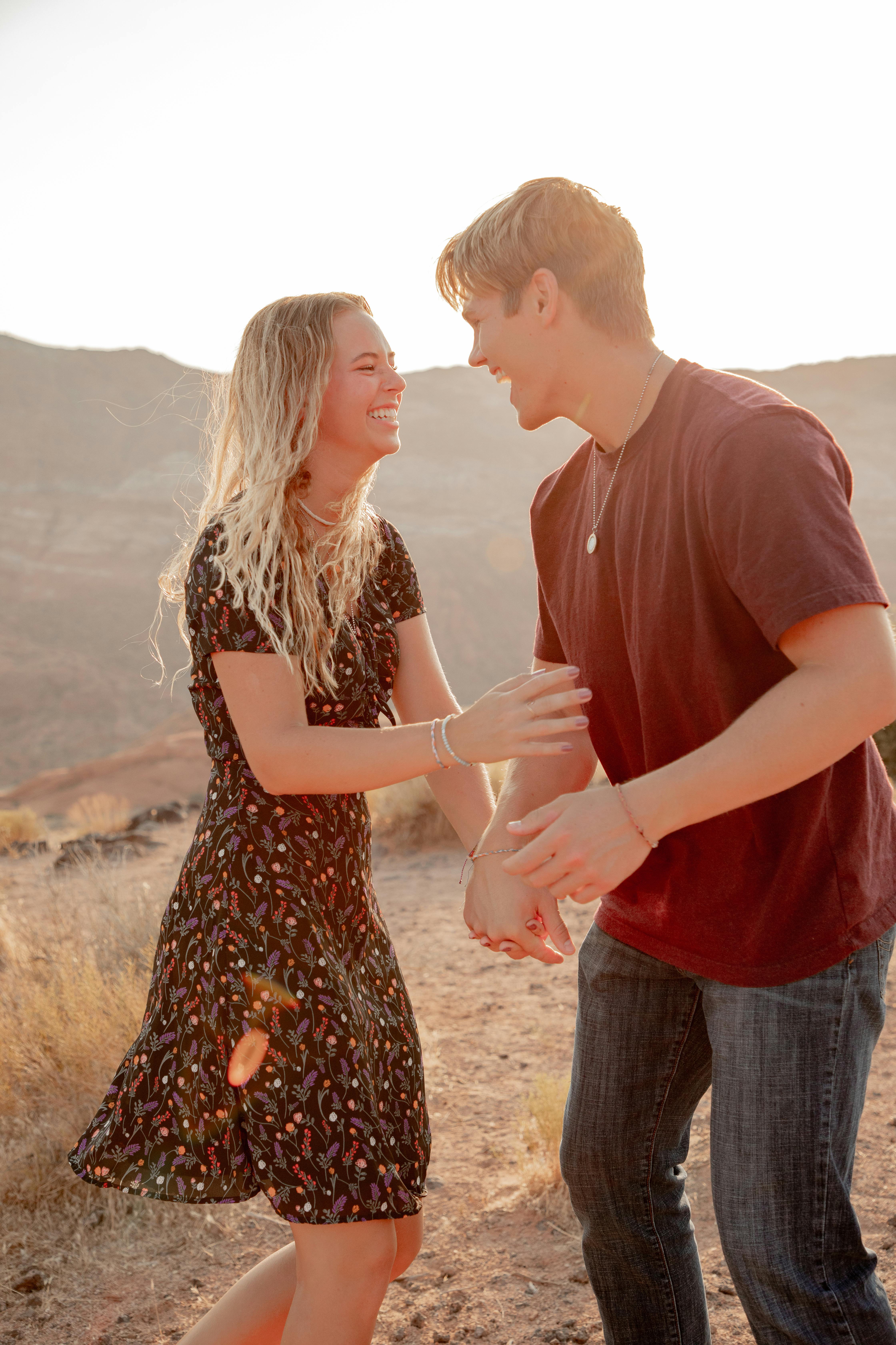 excited couple having fun in desert in summer