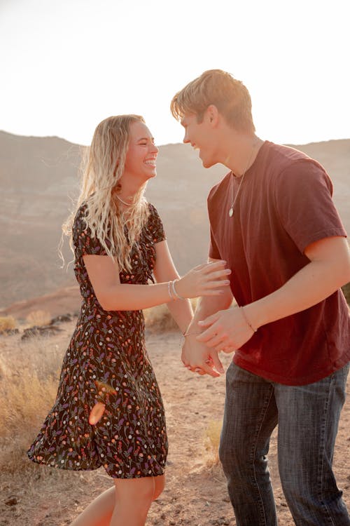 Excited couple having fun in desert in summer