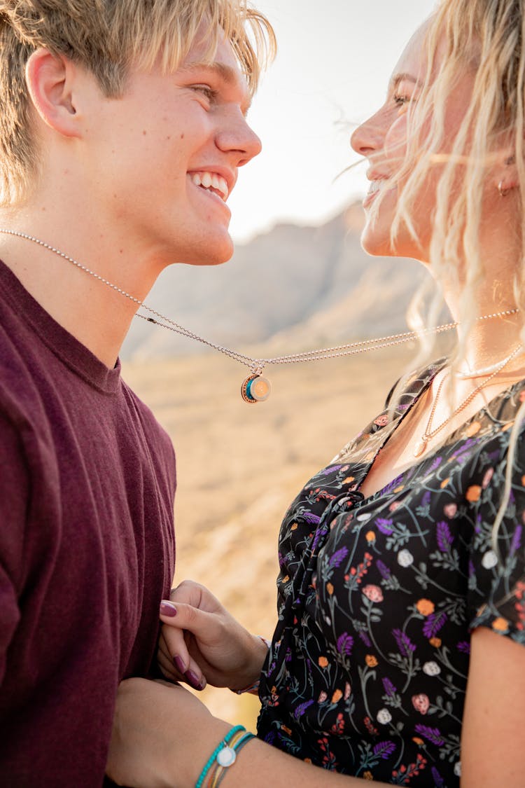 Man And Woman Wearing Necklace