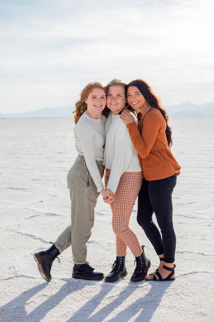 Happy Female Friends Holding Each Other's Hands