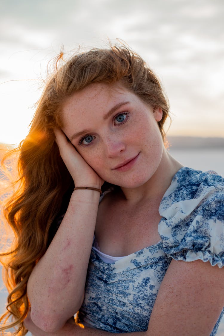 Woman In White And Blue Floral Top