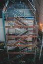 Metal staircase of old building with graffiti