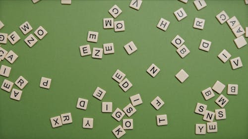  Square Blocks With Letters on Green Surface