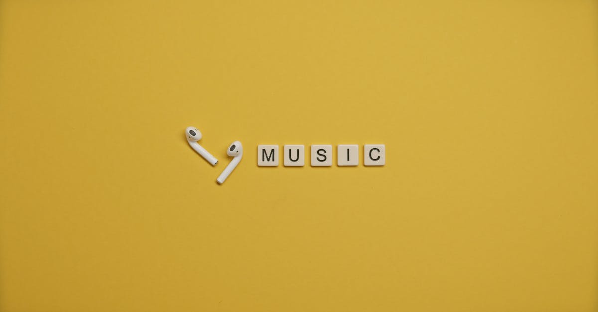 Minimalist image of AirPods and music-themed letter tiles on a vibrant yellow background.