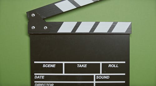 Clapper Board In Green Surface