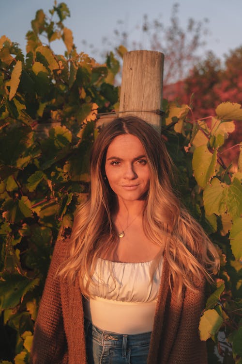 Stylish content woman in autumnal field