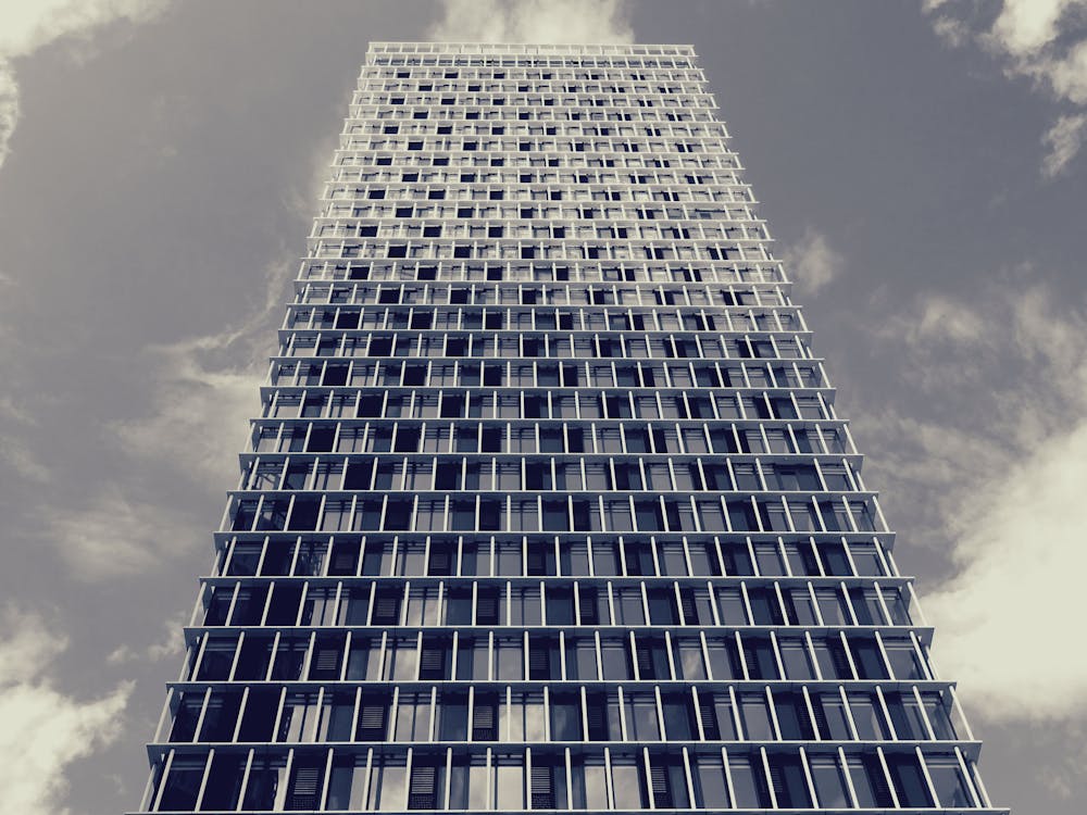 Blue Glass High-rise Building · Free Stock Photo