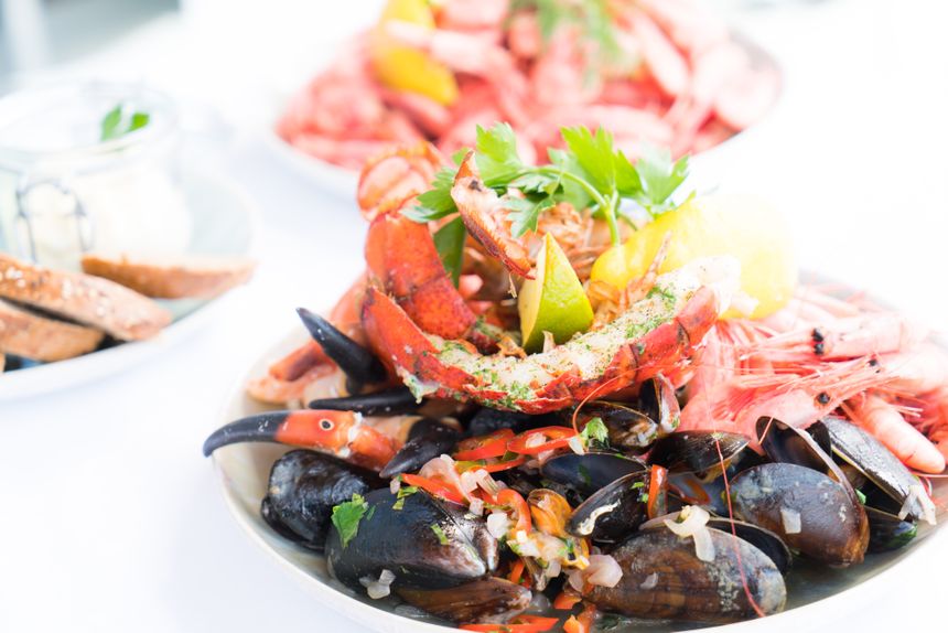 Seafood platter with lobster, mussels and prawns — photo by Terje Sollie on Pexels