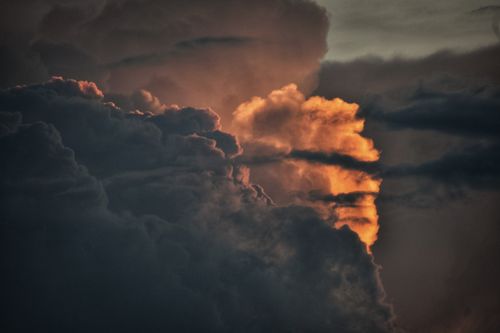 Free Captivating image of storm clouds with sunlight breaking through, creating a dramatic display. Stock Photo
