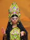 Woman in Green and Yellow Floral Dress Wearing Purple and Yellow Headdress