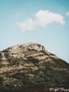 Hill under Blue Cloudy Sky