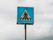 Blue and White Arrow Sign