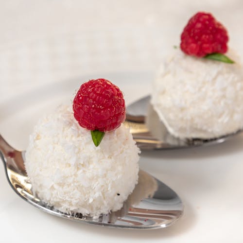 Free Dessert coconut balls with raspberries Stock Photo