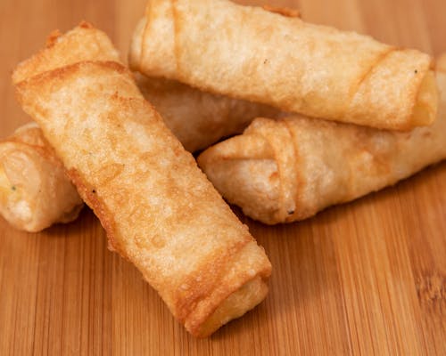 Closeup of fried spring rolls on board