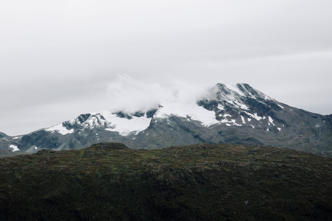 Snow Bound Ridge Mountainous ridge under snow and clouds · Free Stock Photo