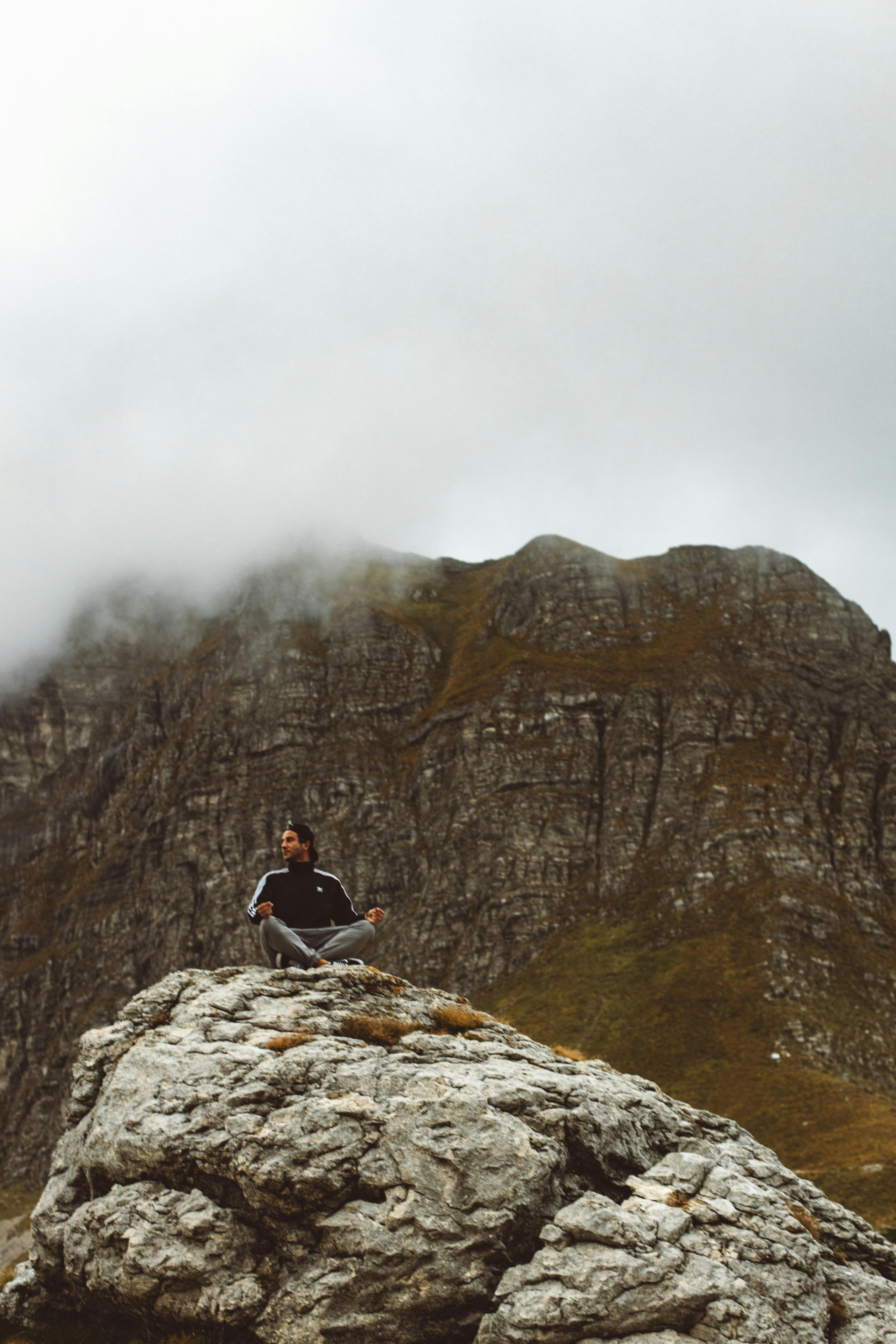 a man sitting on the rock