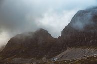 Brown Rocky Mountain Under White Clouds