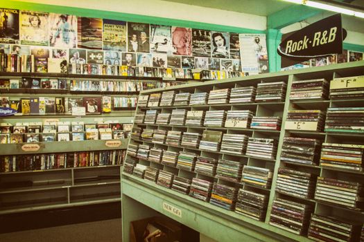 Explore a nostalgic music store with vintage CDs, posters, and a Rock-R&B section.