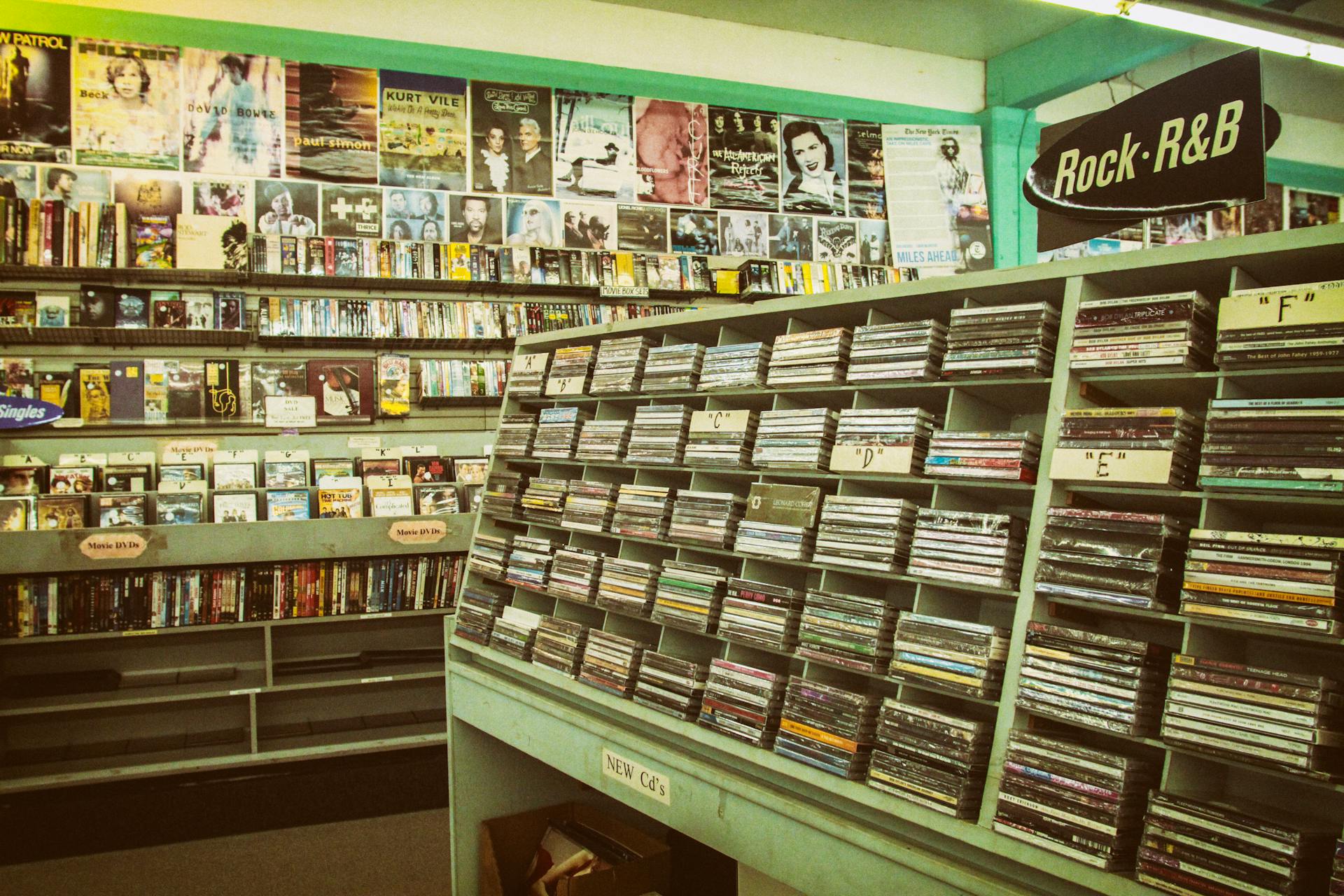 Explore a nostalgic music store with vintage CDs, posters, and a Rock-R&B section.