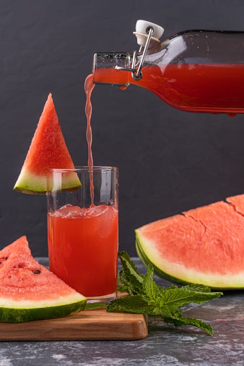 Free Pouring Fresh Watermelon Juice in the Glass Stock Photo