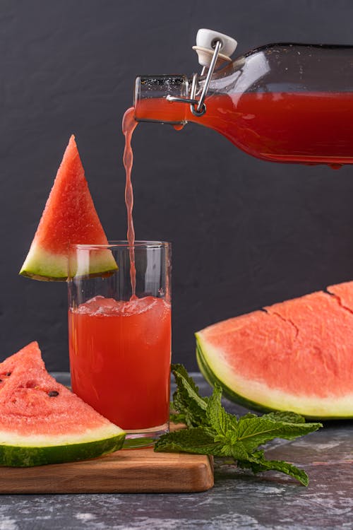 Pouring Fresh Watermelon Juice in the Glass