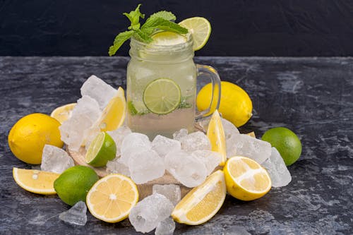 Free  Lemon and Lime Juice in Clear Glass Mug Stock Photo