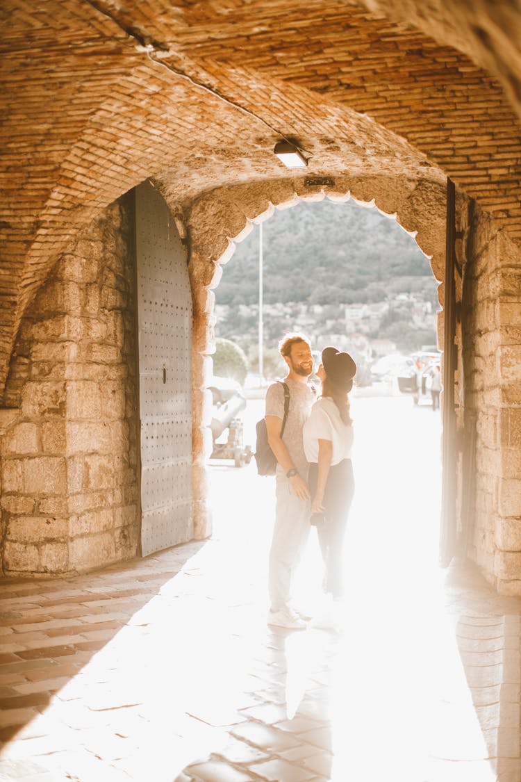 Couple Standing Near The Opened Door