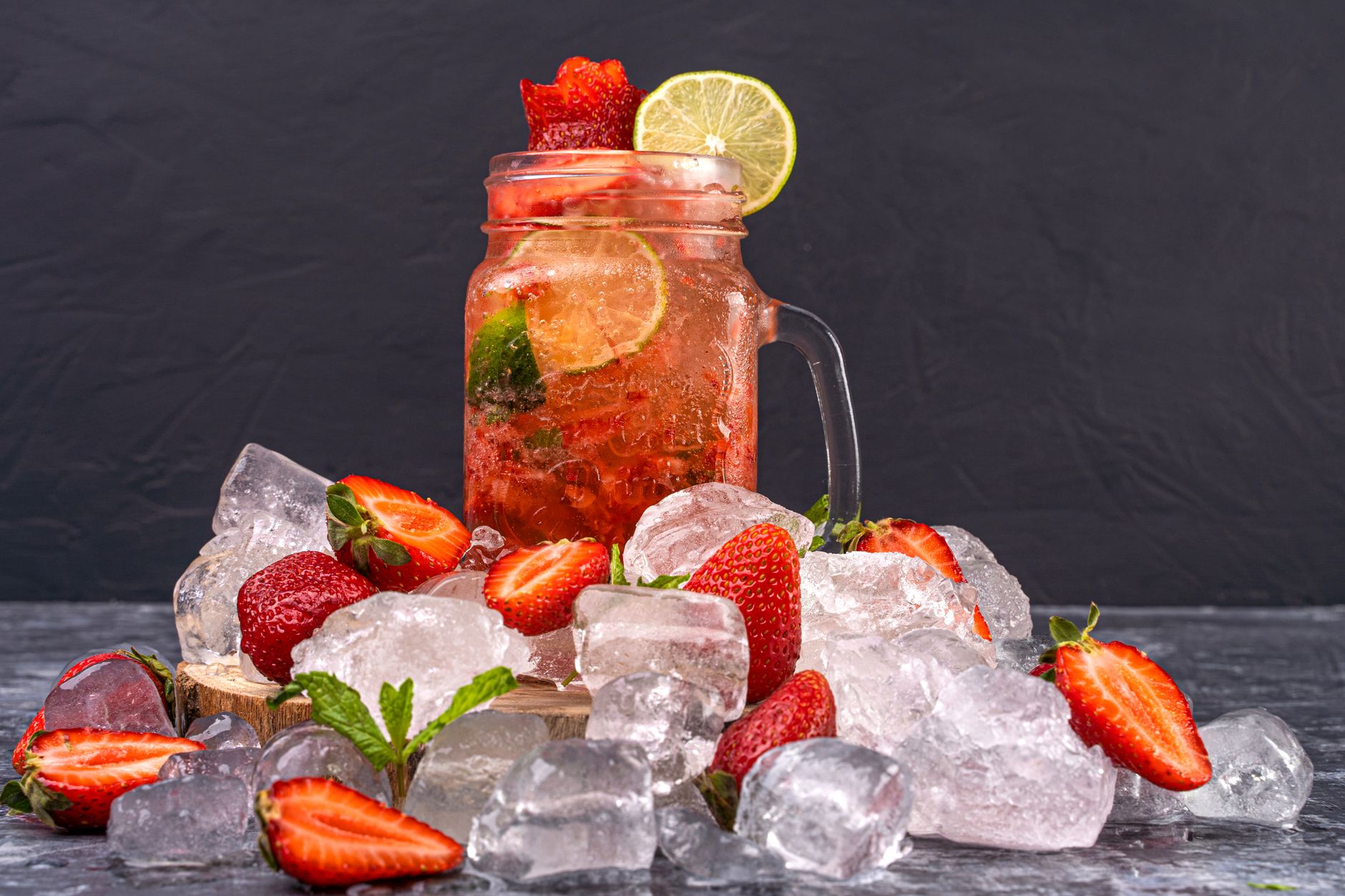 Strawberry Chamomile Iced Tea With Gin in a glass with ice and mint