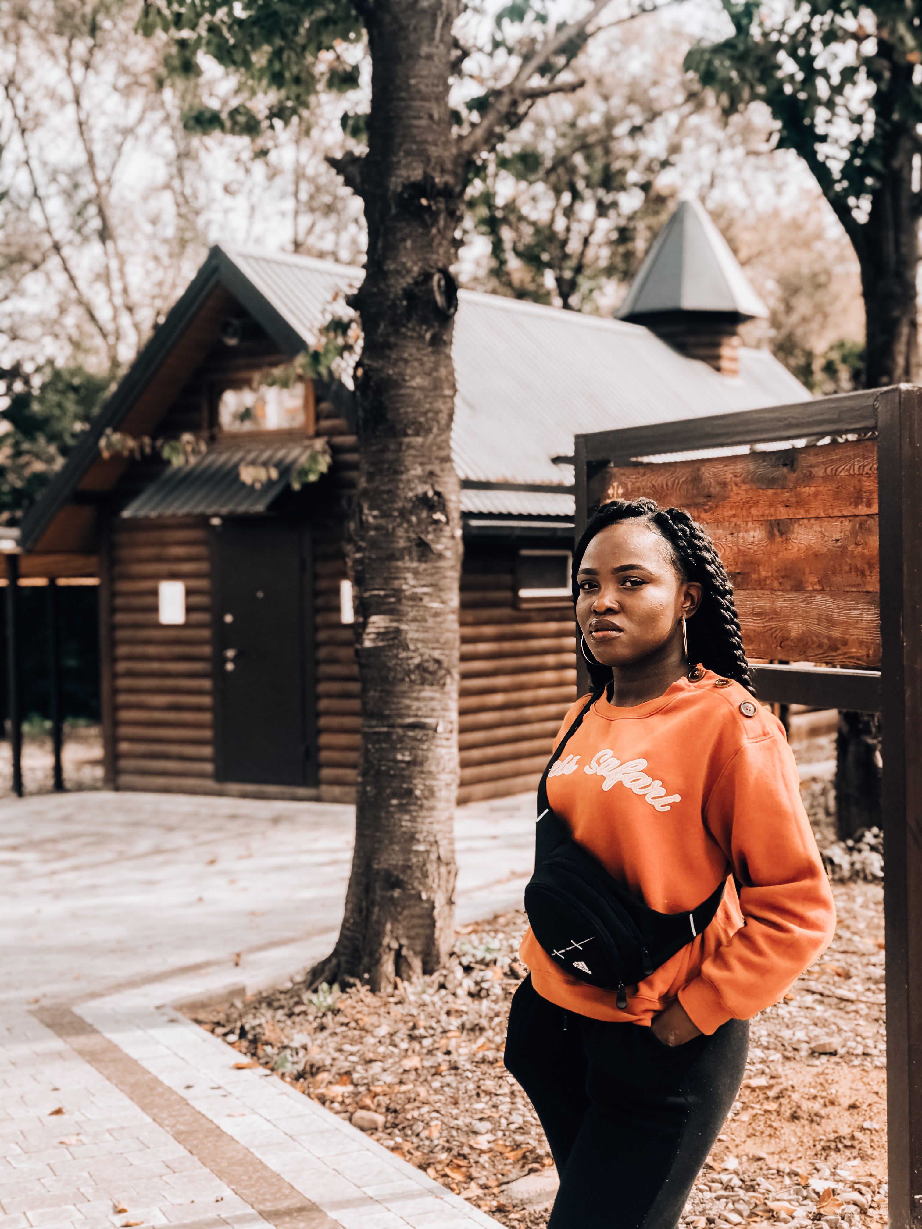 Model wearing a printed streetwear top