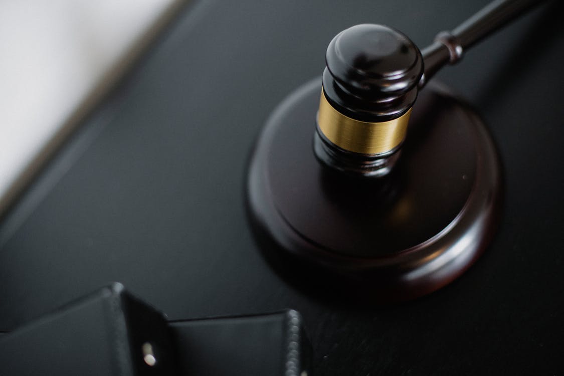 Wooden gavel on table in courtroom