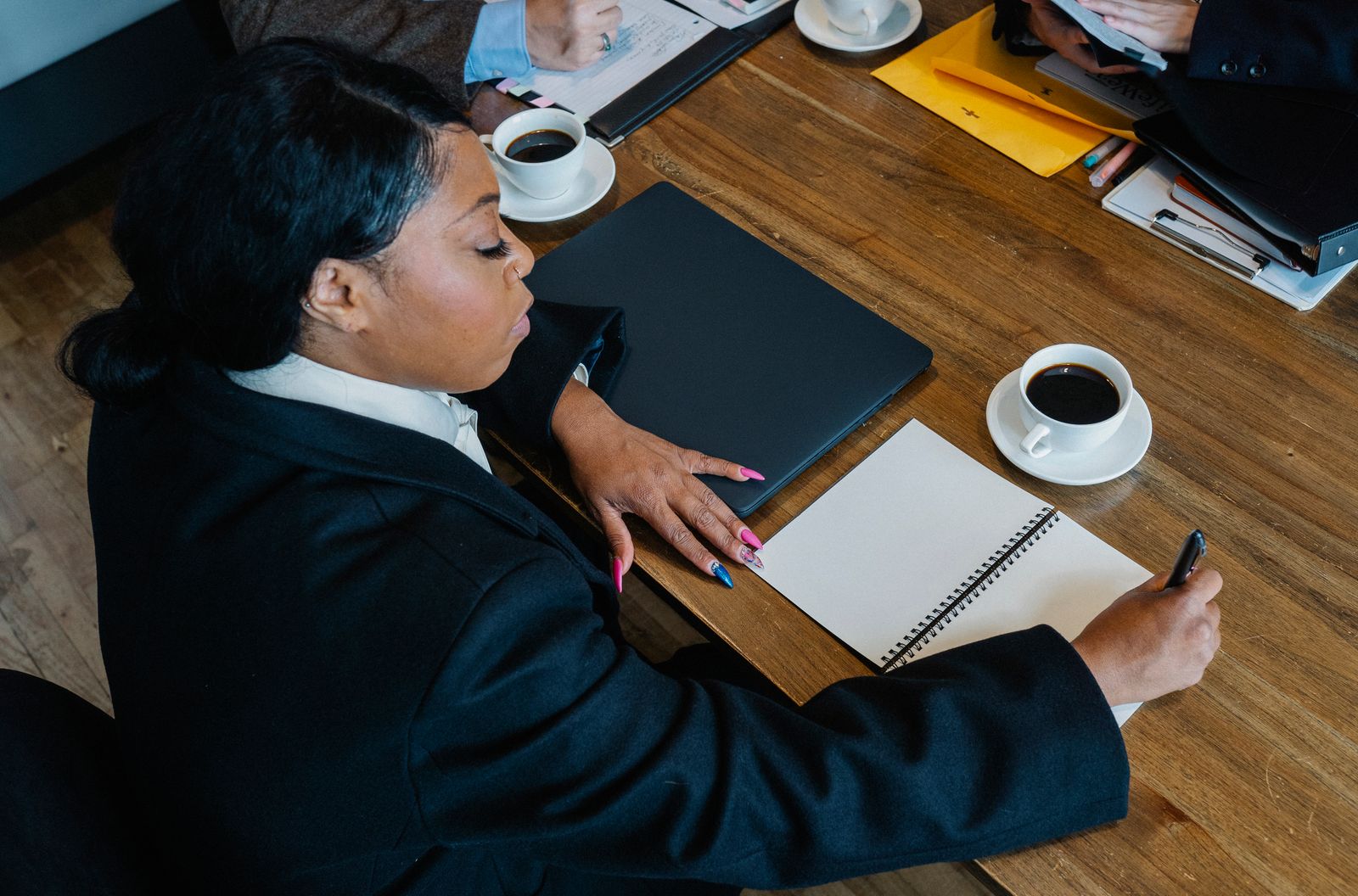 Analyst reviewing charts and reports on a laptop