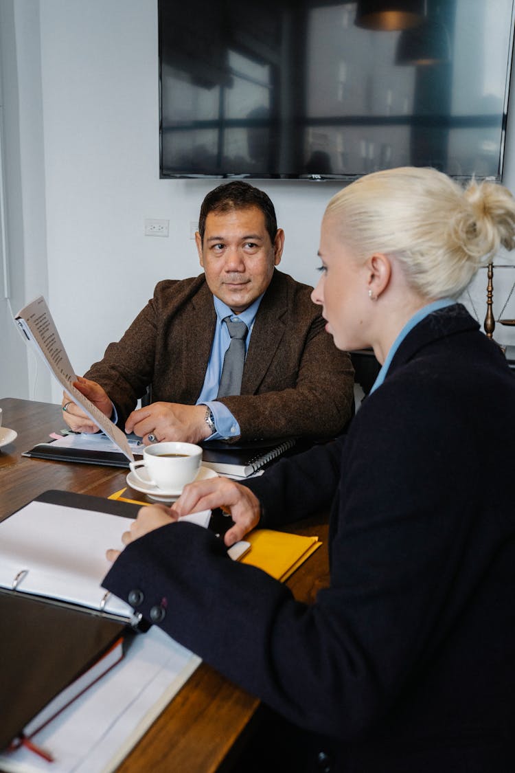 Business People Discussing Project In Office