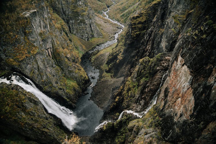 Waterfall In Mountainous Terrain With Steep Slopes