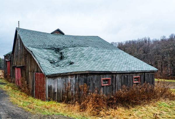 Wind-damaged roof tiles on a house
