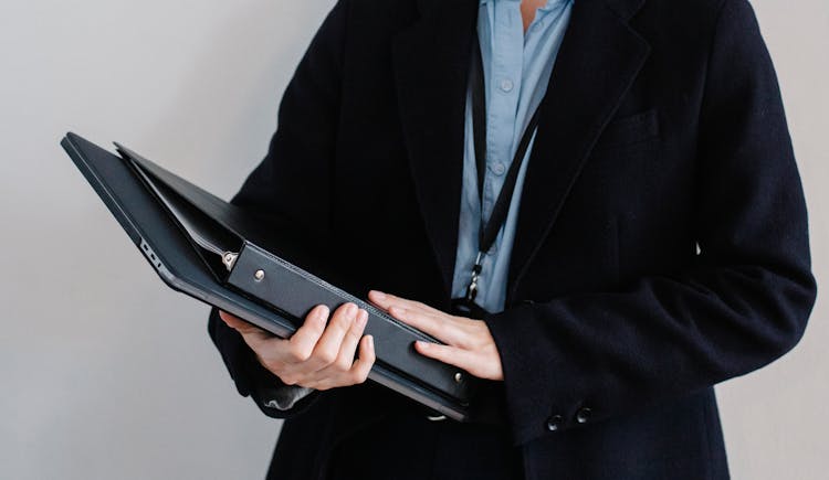 Crop Faceless Office Employee With Folders In Hands