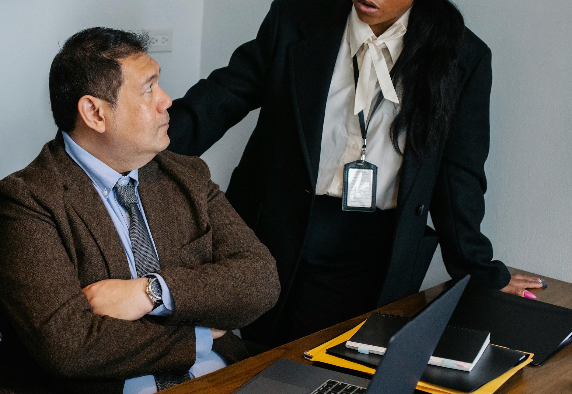 Concentrated multiethnic office workers discussing project