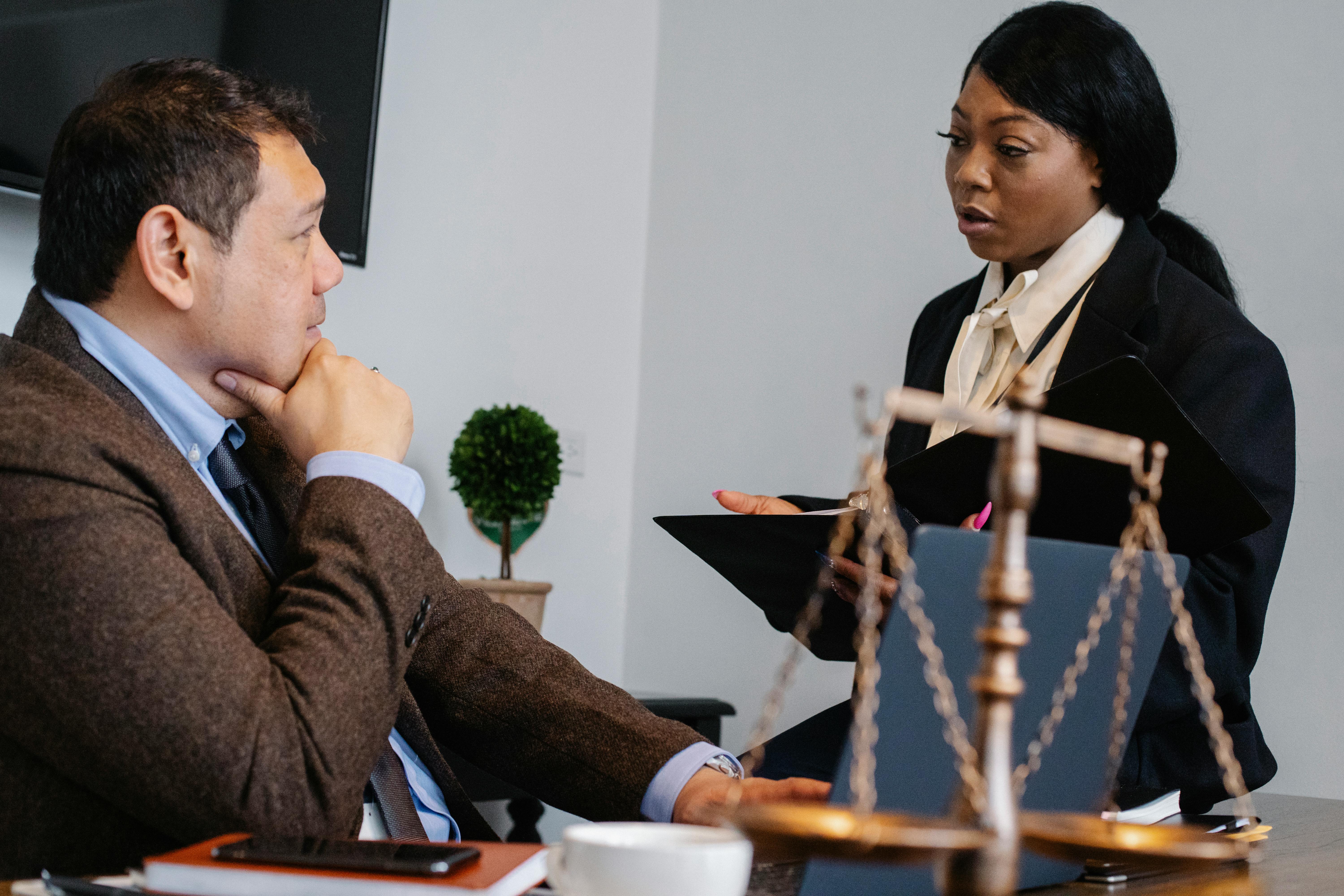 focused multiracial coworkers discussing project