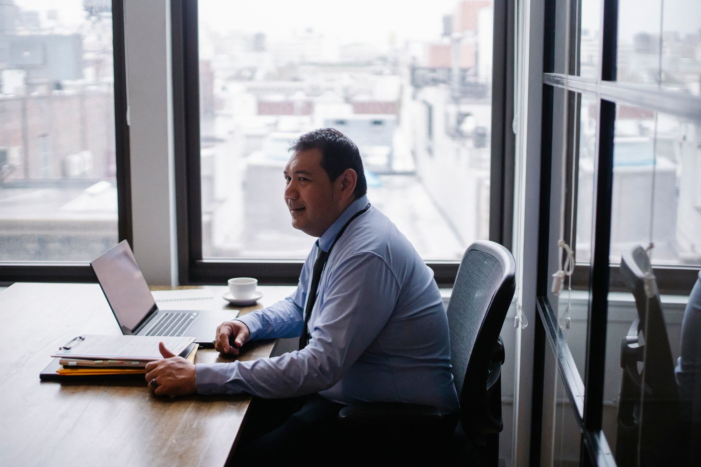 Entrepreneur using a laptop to work on business marketing tasks