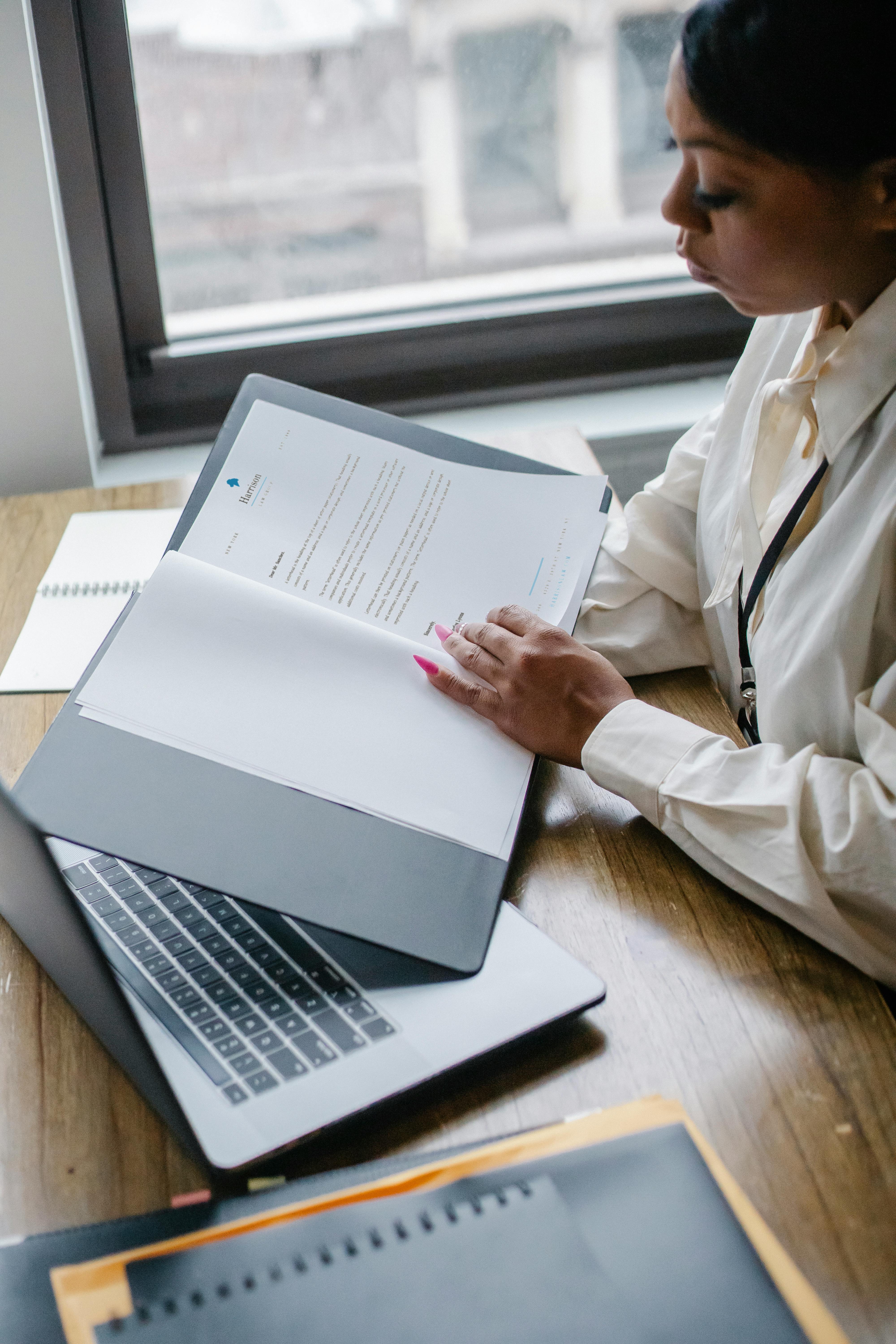 black woman working with documents in office