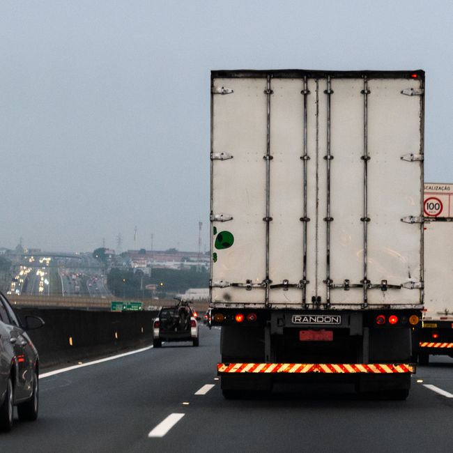 cargo trucks driving on a highway