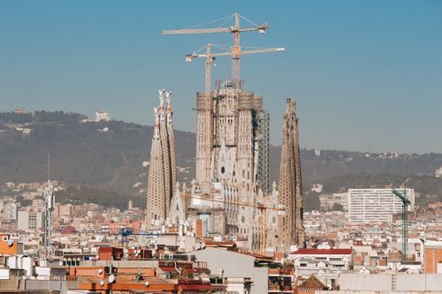 Free A view of the iconic Sagrada Familia under construction on a sunny day in Barcelona. Stock Photo