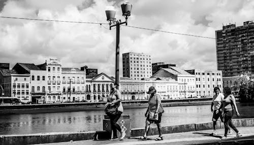 Free Grayscale Photo of People Walking on Sidewalk Stock Photo